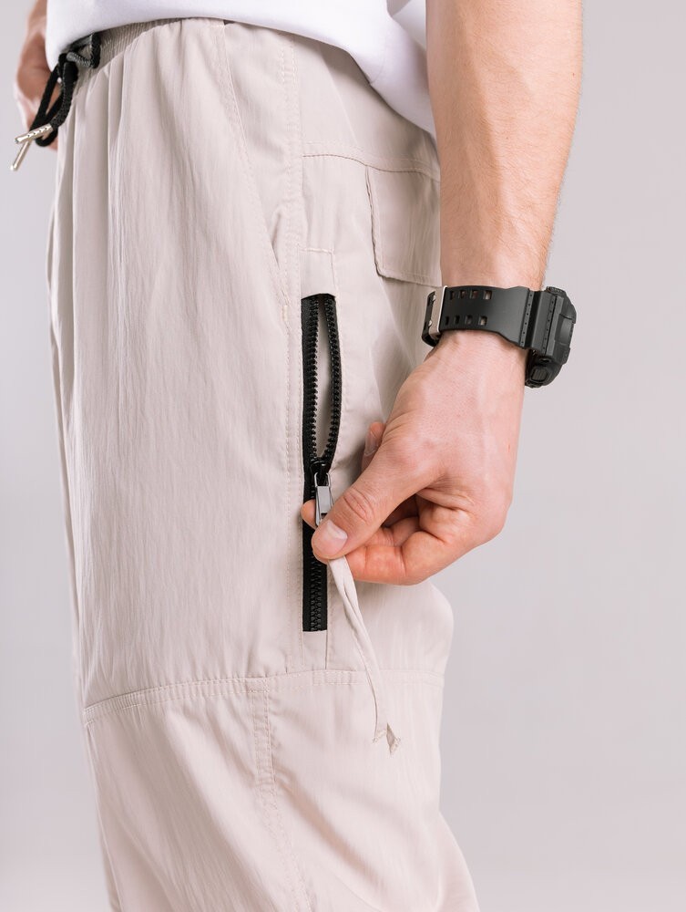 Бежеві чоловічі джогери. Джогери плащівка спорт чоловічі Pobedov Yoxo. Штани джогери з кишенями